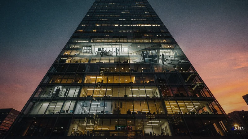 Modern financial district building at sunset where the glass facade reflects both medical facility architecture and trading.